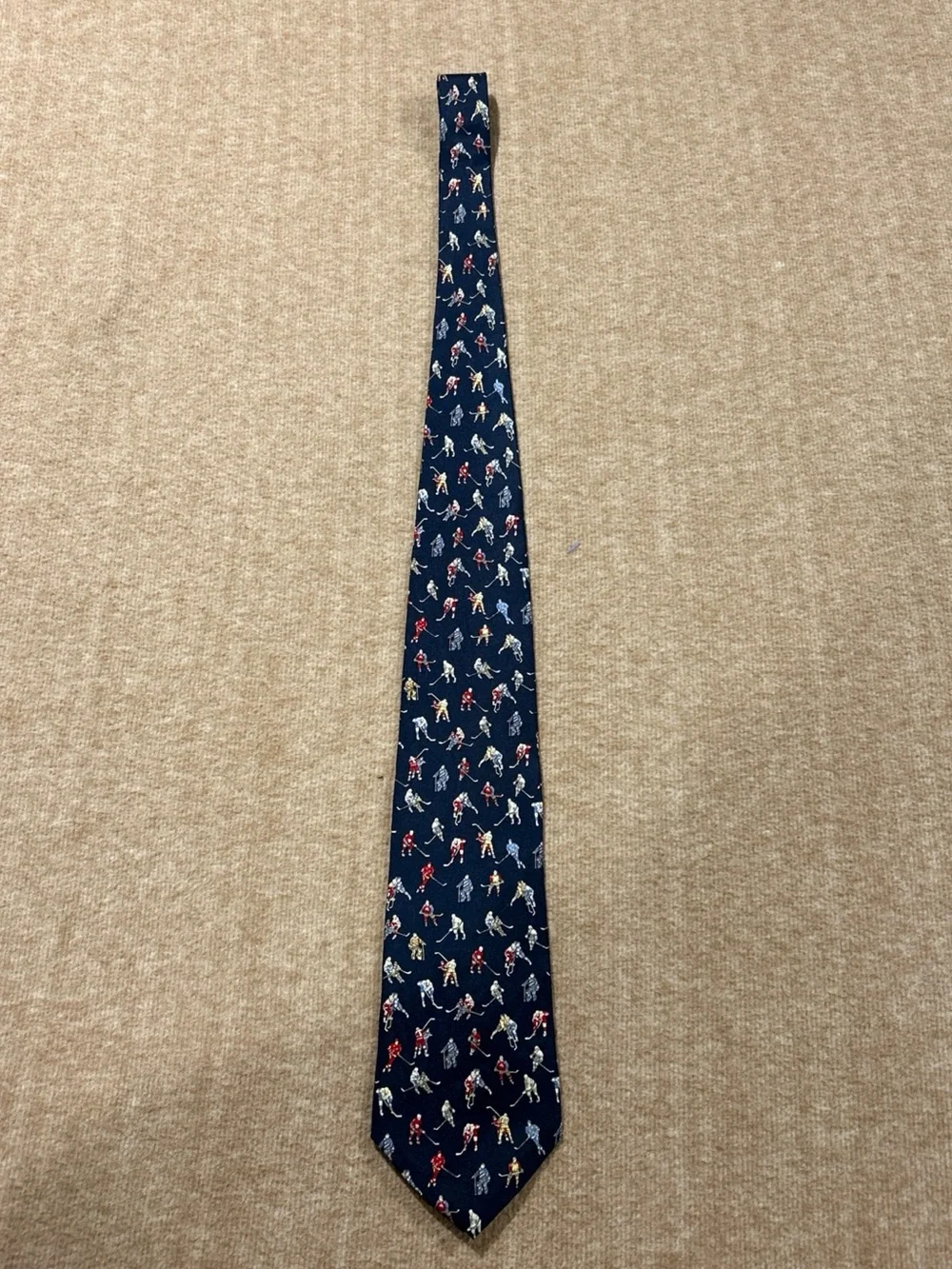 Museum Artifacts Silk Tie with Red, Cream, Blue and Gray Hockey Player Motif